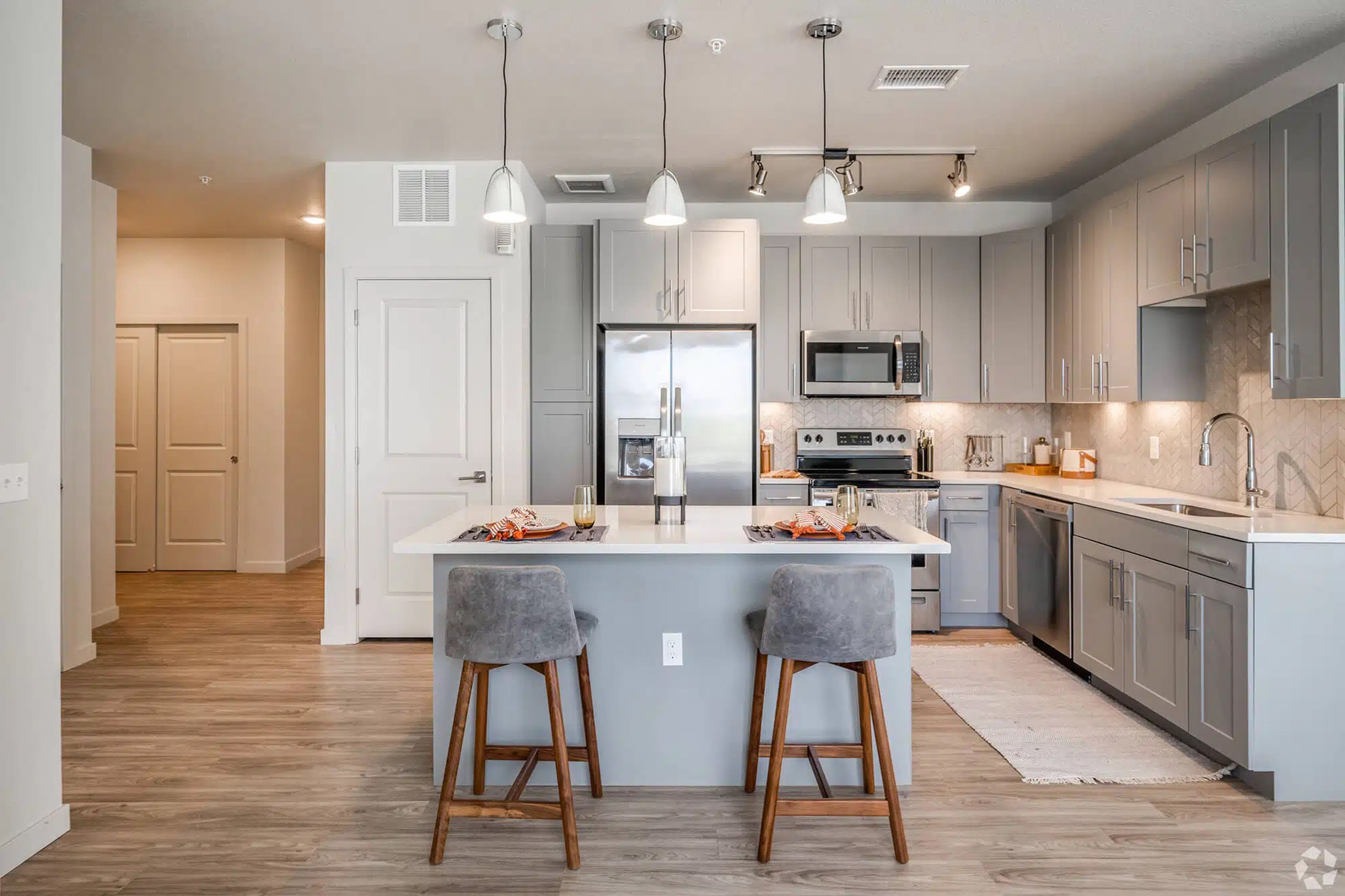 Apartment kitchen with island and stools