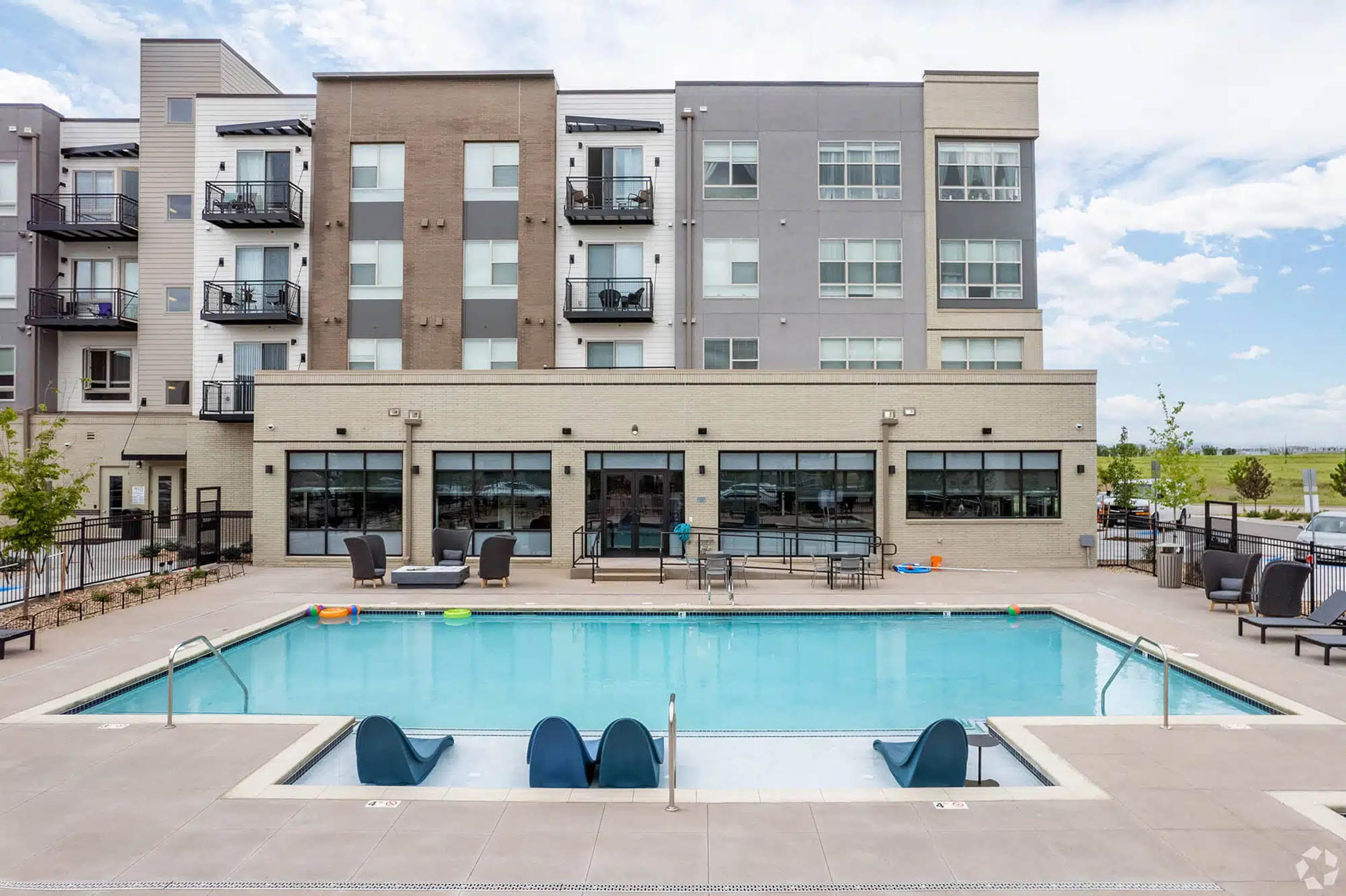 Swimming pool in front of apartment building