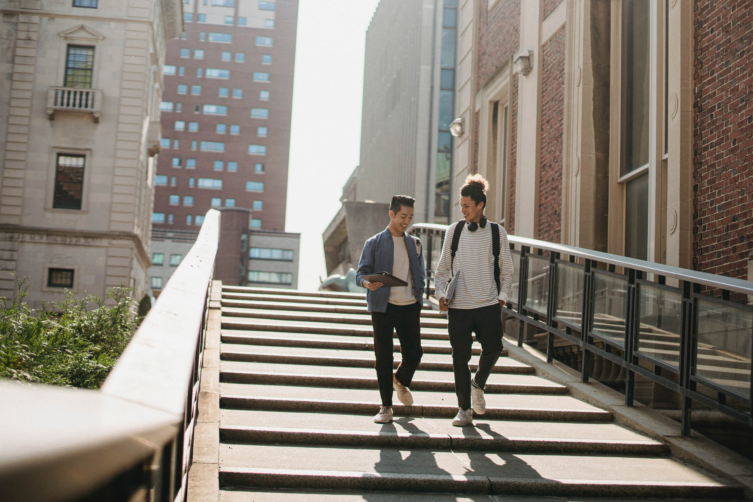 Two men walking down stairs